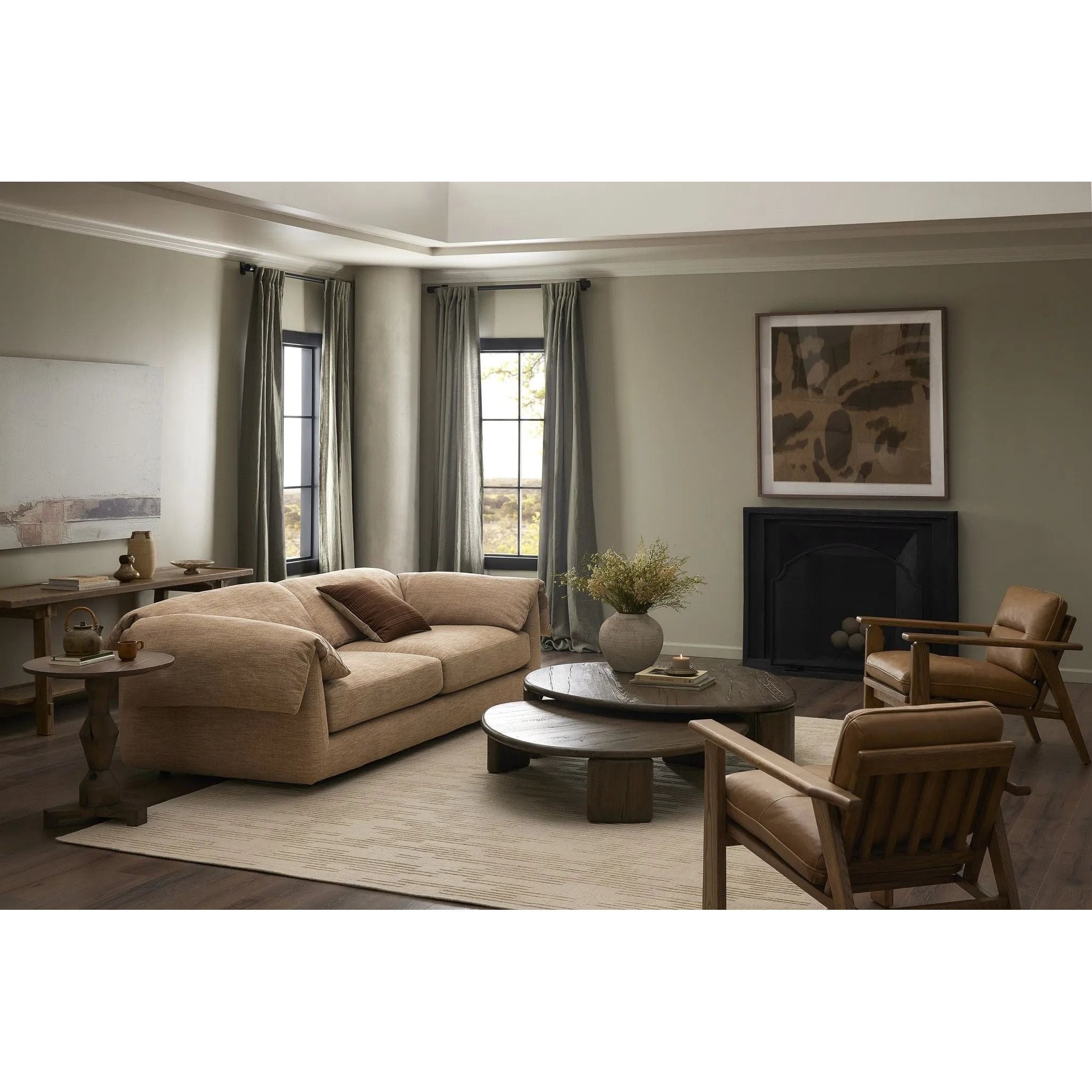 This two-over-two sofa is all about comfort. Feather-filled cushions fold over the frame, complemented by foam-fiber-feather seats. Upholstered in a taupe high-performance fabric, it balances its laid-back look with durability for every day. Amethyst Home provides interior design, new home construction design consulting, vintage area rugs, and lighting in the Los Angeles metro area.