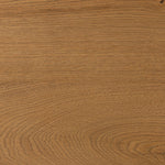 Designed by Thomas Bina and Ronald Sasson, a design partnership blending both modern minimalist and Brazilian influences. A curvy, open-style console table is crafted from natural reclaimed French oak with tapered pedestal panels connected at the base. Amethyst Home provides interior design, new home construction design consulting, vintage area rugs, and lighting in the Alpharetta metro area.
