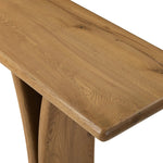 Designed by Thomas Bina and Ronald Sasson, a design partnership blending both modern minimalist and Brazilian influences. A curvy, open-style console table is crafted from natural reclaimed French oak with tapered pedestal panels connected at the base. Amethyst Home provides interior design, new home construction design consulting, vintage area rugs, and lighting in the Calabasas metro area.