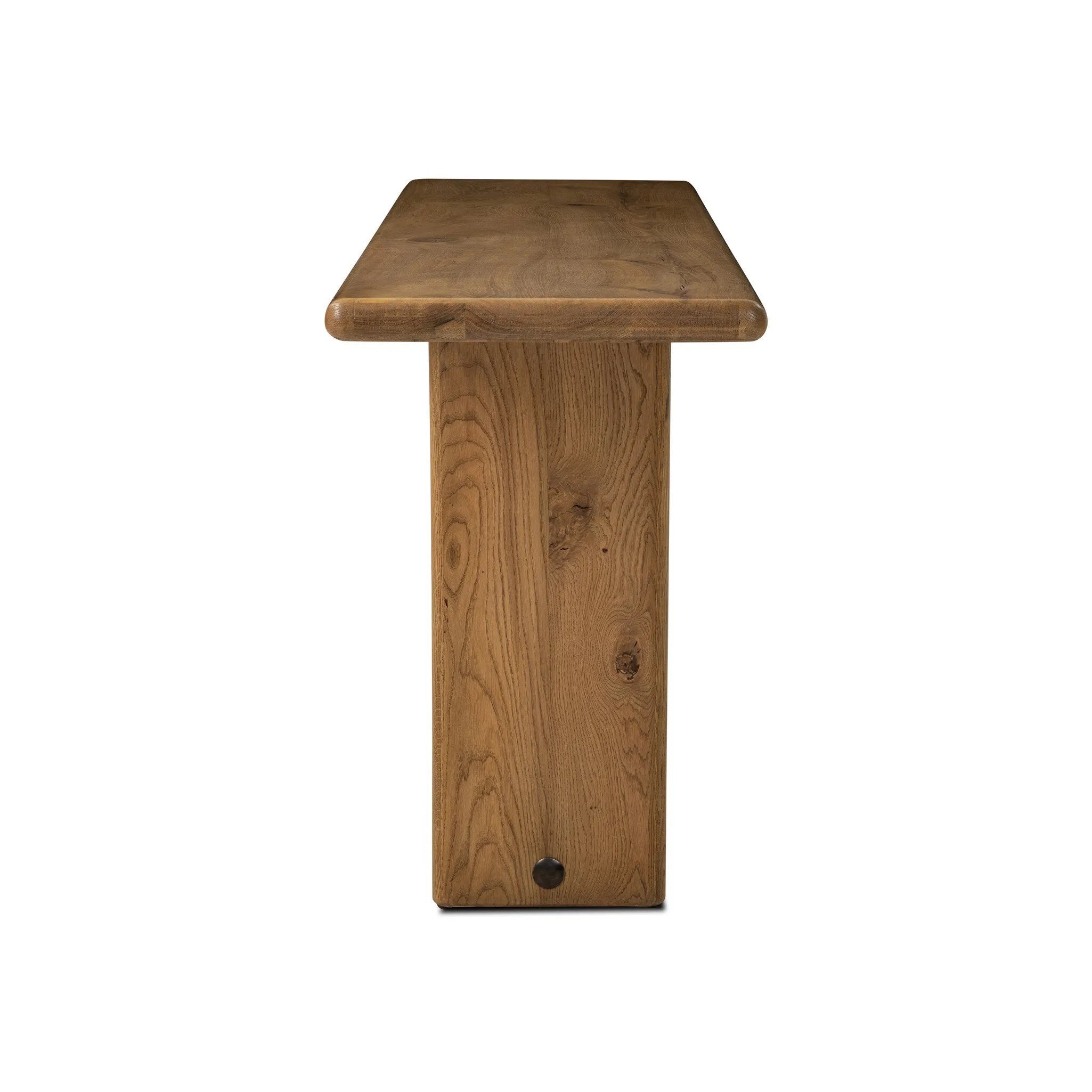 Designed by Thomas Bina and Ronald Sasson, a design partnership blending both modern minimalist and Brazilian influences. A curvy, open-style console table is crafted from natural reclaimed French oak with tapered pedestal panels connected at the base. Amethyst Home provides interior design, new home construction design consulting, vintage area rugs, and lighting in the Dallas metro area.