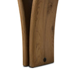 Designed by Thomas Bina and Ronald Sasson, a design partnership blending both modern minimalist and Brazilian influences. A curvy, open-style console table is crafted from natural reclaimed French oak with tapered pedestal panels connected at the base. Amethyst Home provides interior design, new home construction design consulting, vintage area rugs, and lighting in the Tampa metro area.