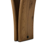 Designed by Thomas Bina and Ronald Sasson, a design partnership blending both modern minimalist and Brazilian influences. A curvy, open-style console table is crafted from natural reclaimed French oak with tapered pedestal panels connected at the base. Amethyst Home provides interior design, new home construction design consulting, vintage area rugs, and lighting in the Tampa metro area.