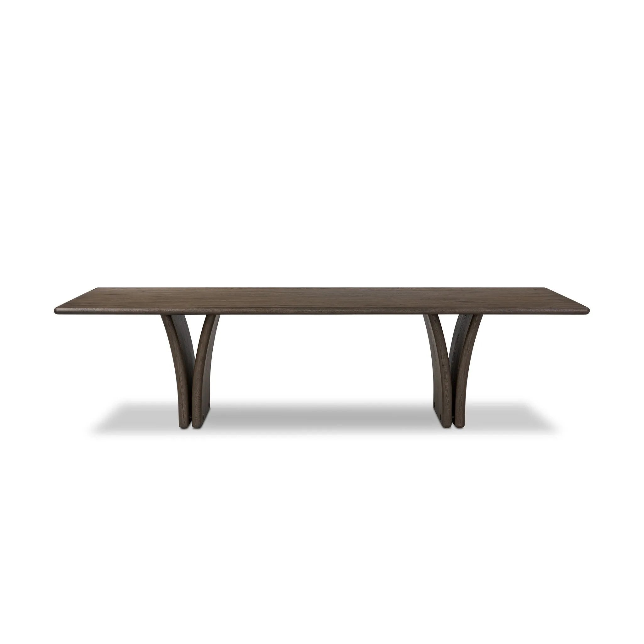 Designed by Thomas Bina and Ronald Sasson, a design partnership blending both modern minimalist and Brazilian influences. Grand-scale dining table is crafted from natural reclaimed French oak with tapered pedestal panels connected at the base Amethyst Home provides interior design, new home construction design consulting, vintage area rugs, and lighting in the Boston metro area.
