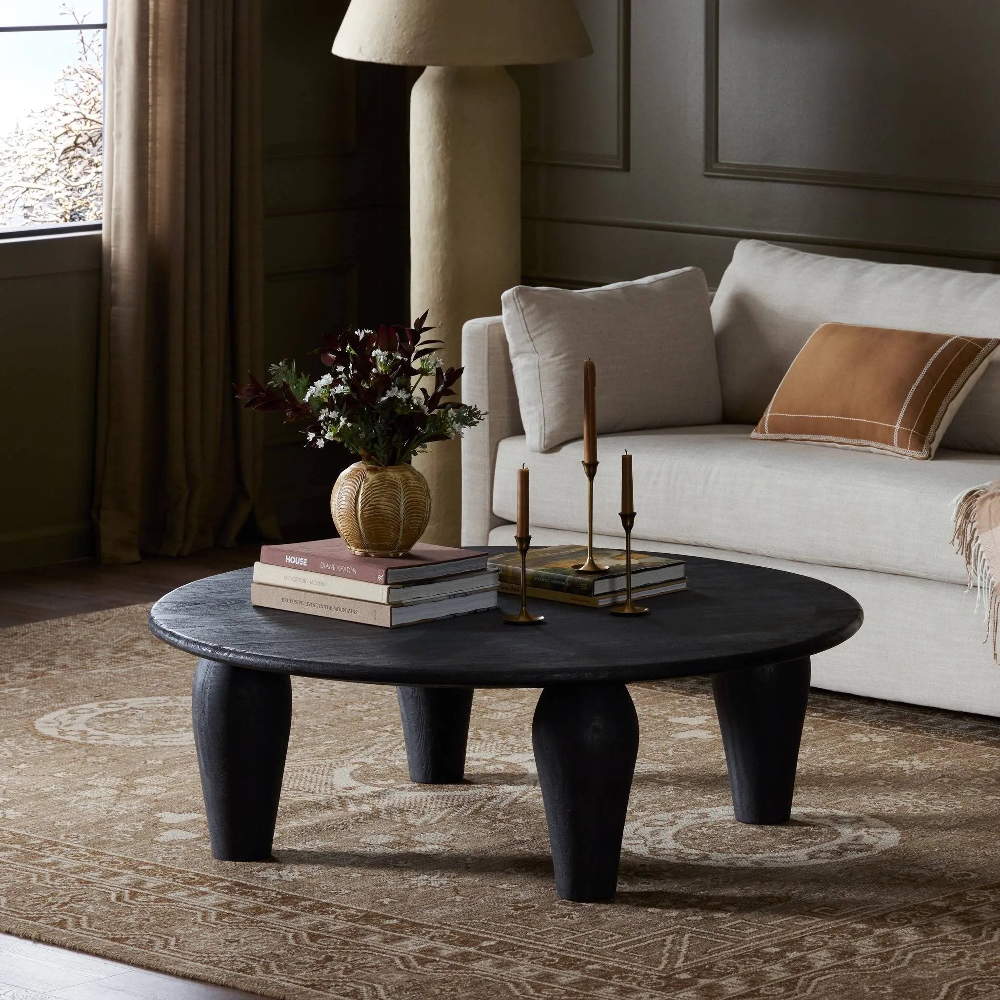 Play up proportions. Large, shapely, legs support a rounded tabletop of light black-finished solid reclaimed woods, for a global, organic look and handcrafted feel Amethyst Home provides interior design, new home construction design consulting, vintage area rugs, and lighting in the Calabasas metro area.