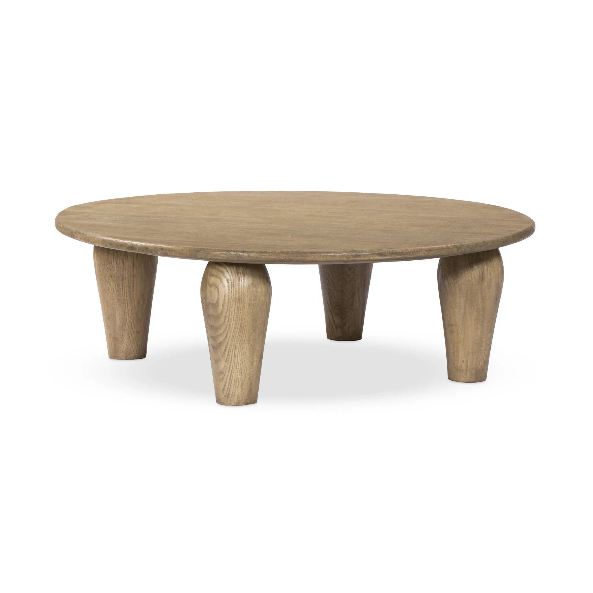 Play up proportions. Large, shapely legs support a rounded tabletop of worn oak, for a global, organic look and handcrafted feel Amethyst Home provides interior design, new home construction design consulting, vintage area rugs, and lighting in the Dallas metro area.