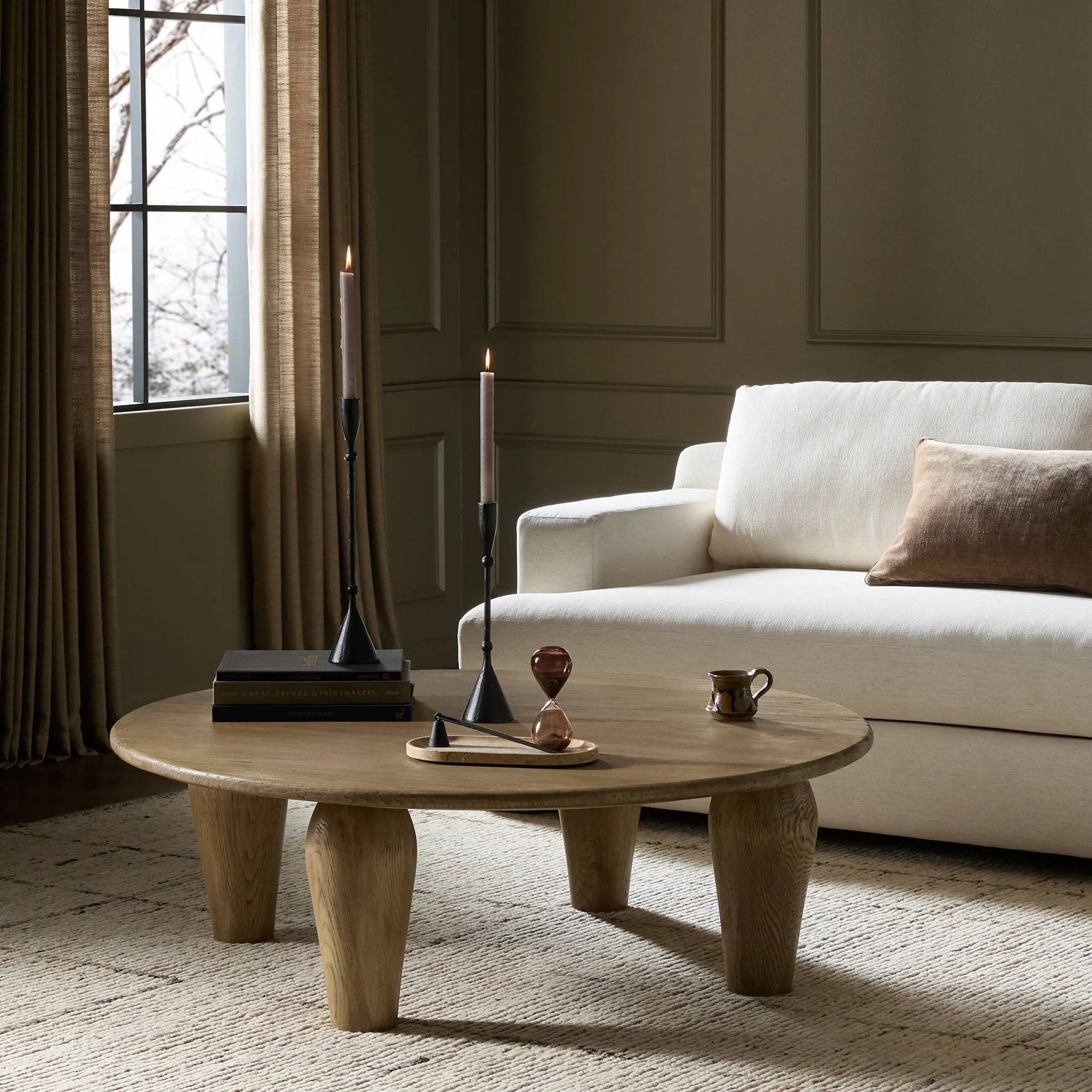 Play up proportions. Large, shapely legs support a rounded tabletop of worn oak, for a global, organic look and handcrafted feel Amethyst Home provides interior design, new home construction design consulting, vintage area rugs, and lighting in the Washington metro area.