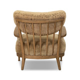 Classic Scandinavian design gets a supersoft update with a winged back panel of amber-finished oak floating above a chunky seat with exposed spindles. Paddle arms and ball feet add to the minimalist design. Covered in natural beige shearling for extra texture and comfort Amethyst Home provides interior design, new home construction design consulting, vintage area rugs, and lighting in the Alpharetta metro area.