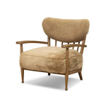 Classic Scandinavian design gets a supersoft update with a winged back panel of amber-finished oak floating above a chunky seat with exposed spindles. Paddle arms and ball feet add to the minimalist design. Covered in natural beige shearling for extra texture and comfort Amethyst Home provides interior design, new home construction design consulting, vintage area rugs, and lighting in the Laguna Beach metro area.