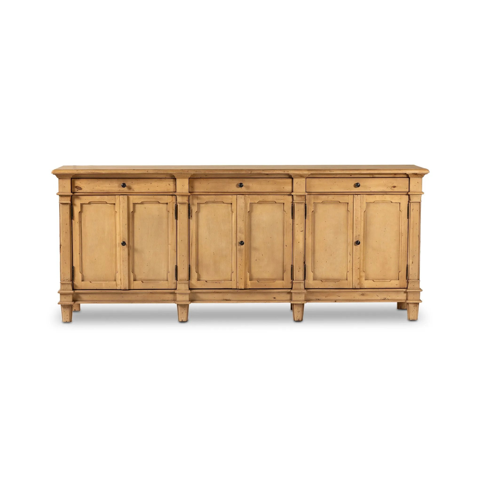 Inspired by European antiques, this solid pine sideboard features classic molding and detailing with distressed copper hardware for an authentic heirloom look and feel. Grand in scale with plenty of interior storage including three top drawers. Rear cutouts for cord management Amethyst Home provides interior design, new home construction design consulting, vintage area rugs, and lighting in the Tampa metro area.