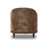 A traditional shape with modern styling, turned wooden legs complement the soft curves of this lounge-worthy chair. A chenill