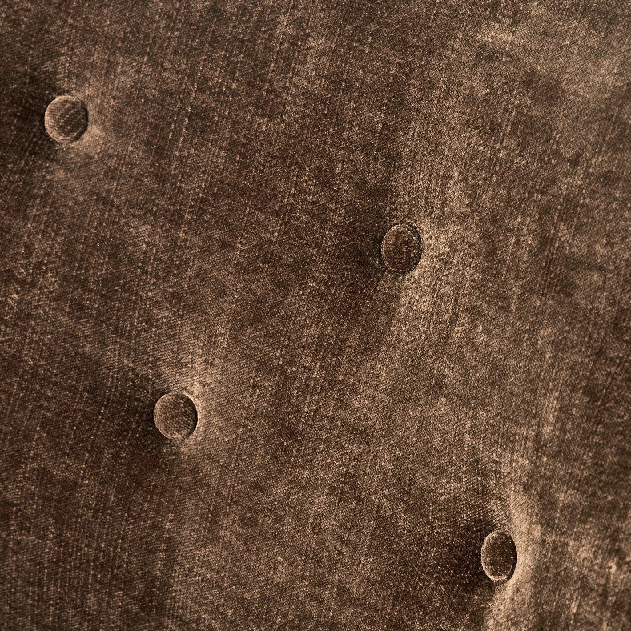 A traditional shape with modern styling, turned wooden legs complement the soft curves of this lounge-worthy chair. A chenill