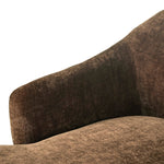 A traditional shape with modern styling, turned wooden legs complement the soft curves of this lounge-worthy chair. A chenill