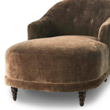 A traditional shape with modern styling, turned wooden legs complement the soft curves of this lounge-worthy chair. A chenill