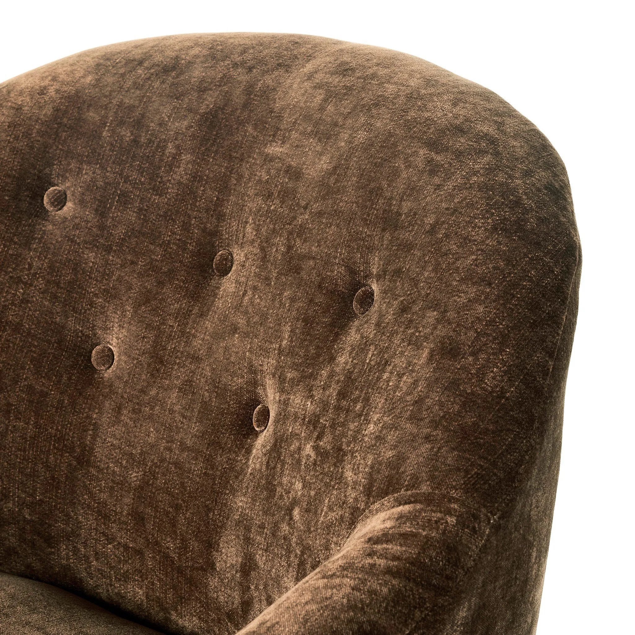 A traditional shape with modern styling, turned wooden legs complement the soft curves of this lounge-worthy chair. A chenill