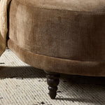 A traditional shape with modern styling, turned wooden legs complement the soft curves of this lounge-worthy chair. A chenill