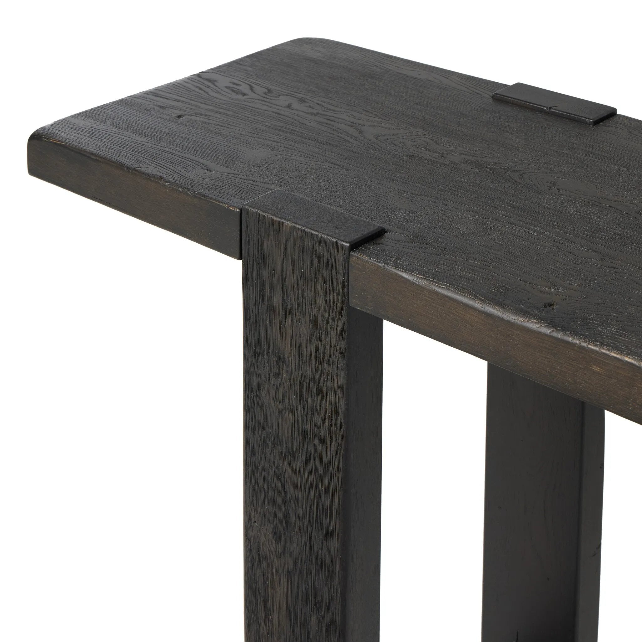 Smoked black oak shapes a simple, open-style console table, with through-tenon joints for an updated farmhouse look.As lovers of luxe style at Amethyst, we love the warm modern inspired Matei Console Table - Smoked Black. This item pairs well with other brands such as Surya and is perfect for minimalist homes Amethyst Home provides interior design, new home construction design consulting, vintage area rugs, and lighting in the Scottsdale metro area.