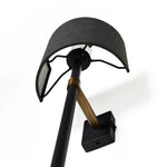 Featuring Maurice Matte Black Plaster Sconce by Four Hands at Amethyst Home. Housed behind a curved black shade, light beams with a soft glow both upward and downward from this plug-in sconce.  A  slim pole to hide the cord and a convenient switch on the backplate create a seamless look.Overall Dimensions: 8.00"w x 7.50"d x 50.00"hWeight : 6.61 lbsMaterial. Amethyst Home provides interior design, new home construction design consulting, vintage area rugs, and lighting in the Alpharetta metro area.