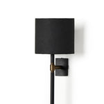 Featuring Maurice Matte Black Plaster Sconce by Four Hands at Amethyst Home. Housed behind a curved black shade, light beams with a soft glow both upward and downward from this plug-in sconce.  A  slim pole to hide the cord and a convenient switch on the backplate create a seamless look.Overall Dimensions: 8.00"w x 7.50"d x 50.00"hWeight : 6.61 lbsMateria. Amethyst Home provides interior design, new home construction design consulting, vintage area rugs, and lighting in the Kansas City metro area.