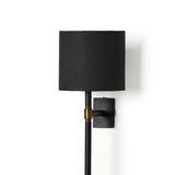 Featuring Maurice Matte Black Plaster Sconce by Four Hands at Amethyst Home. Housed behind a curved black shade, light beams with a soft glow both upward and downward from this plug-in sconce.  A  slim pole to hide the cord and a convenient switch on the backplate create a seamless look.Overall Dimensions: 8.00"w x 7.50"d x 50.00"hWeight : 6.61 lbsMateria. Amethyst Home provides interior design, new home construction design consulting, vintage area rugs, and lighting in the Kansas City metro area.