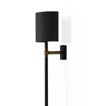 Featuring Maurice Matte Black Plaster Sconce by Four Hands at Amethyst Home. Housed behind a curved black shade, light beams with a soft glow both upward and downward from this plug-in sconce.  A  slim pole to hide the cord and a convenient switch on the backplate create a seamless look.Overall Dimensions: 8.00"w x 7.50"d x 50.00"hWeight : 6.61 lbsMaterials:. Amethyst Home provides interior design, new home construction design consulting, vintage area rugs, and lighting in the Monterey metro area.