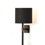 Featuring Maurice Matte Black Plaster Sconce by Four Hands at Amethyst Home. Housed behind a curved black shade, light beams with a soft glow both upward and downward from this plug-in sconce.  A  slim pole to hide the cord and a convenient switch on the backplate create a seamless look.Overall Dimensions: 8.00"w x 7.50"d x 50.00"hWeight : 6.61 lbsMaterials: Ir. Amethyst Home provides interior design, new home construction design consulting, vintage area rugs, and lighting in the Tampa metro area.