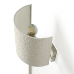 Featuring Maurice Matte White Plaster Sconce by Four Hands at Amethyst Home. Housed behind a curved black shade, light beams with a soft glow both upward and downward from this plug-in sconce.  A  slim pole to hide the cord and a convenient switch on the backplate create a seamless look.Overall Dimensions: 8.00"w x 7.50"d x 50.00"hWeight : 6.61 lbsMaterials: . Amethyst Home provides interior design, new home construction design consulting, vintage area rugs, and lighting in the Houston metro area.
