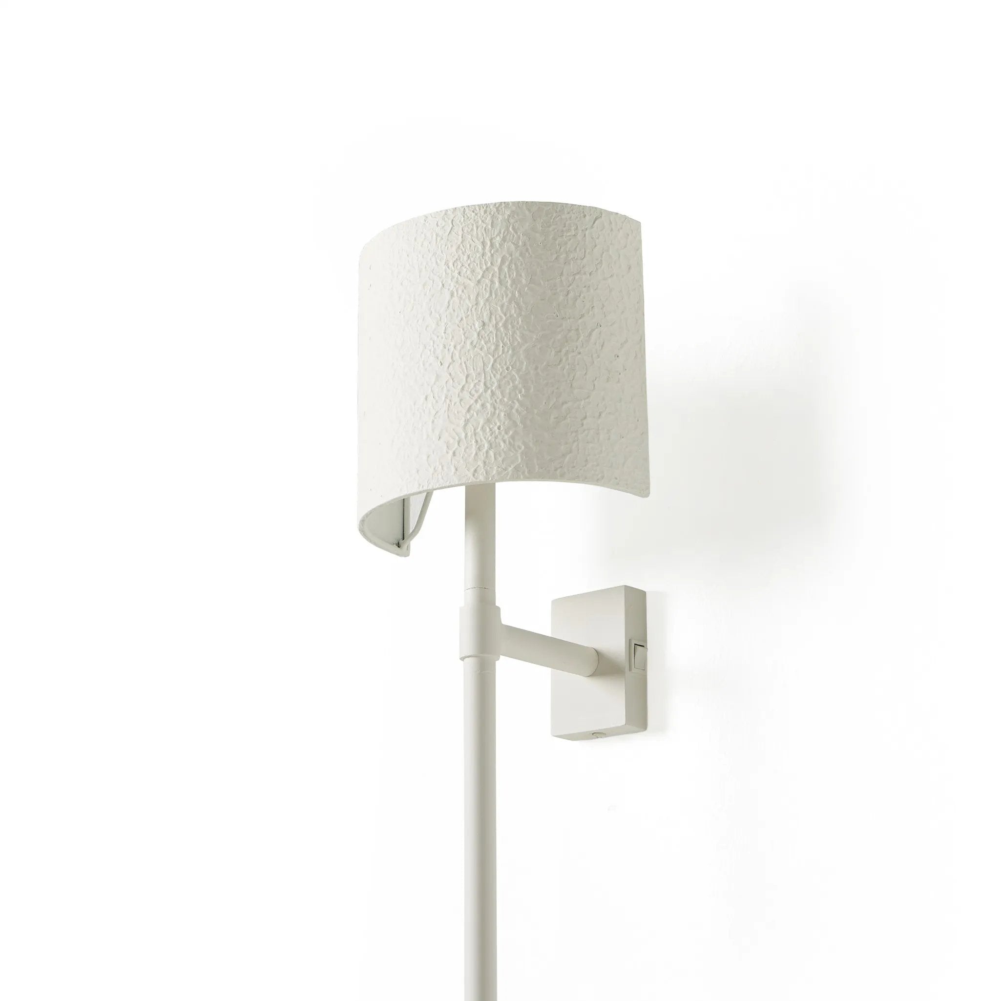 Featuring Maurice Matte White Plaster Sconce by Four Hands at Amethyst Home. Housed behind a curved black shade, light beams with a soft glow both upward and downward from this plug-in sconce.  A  slim pole to hide the cord and a convenient switch on the backplate create a seamless look.Overall Dimensions: 8.00"w x 7.50"d x 50.00"hWeight : 6.61 lbsMaterials:. Amethyst Home provides interior design, new home construction design consulting, vintage area rugs, and lighting in the Portland metro area.