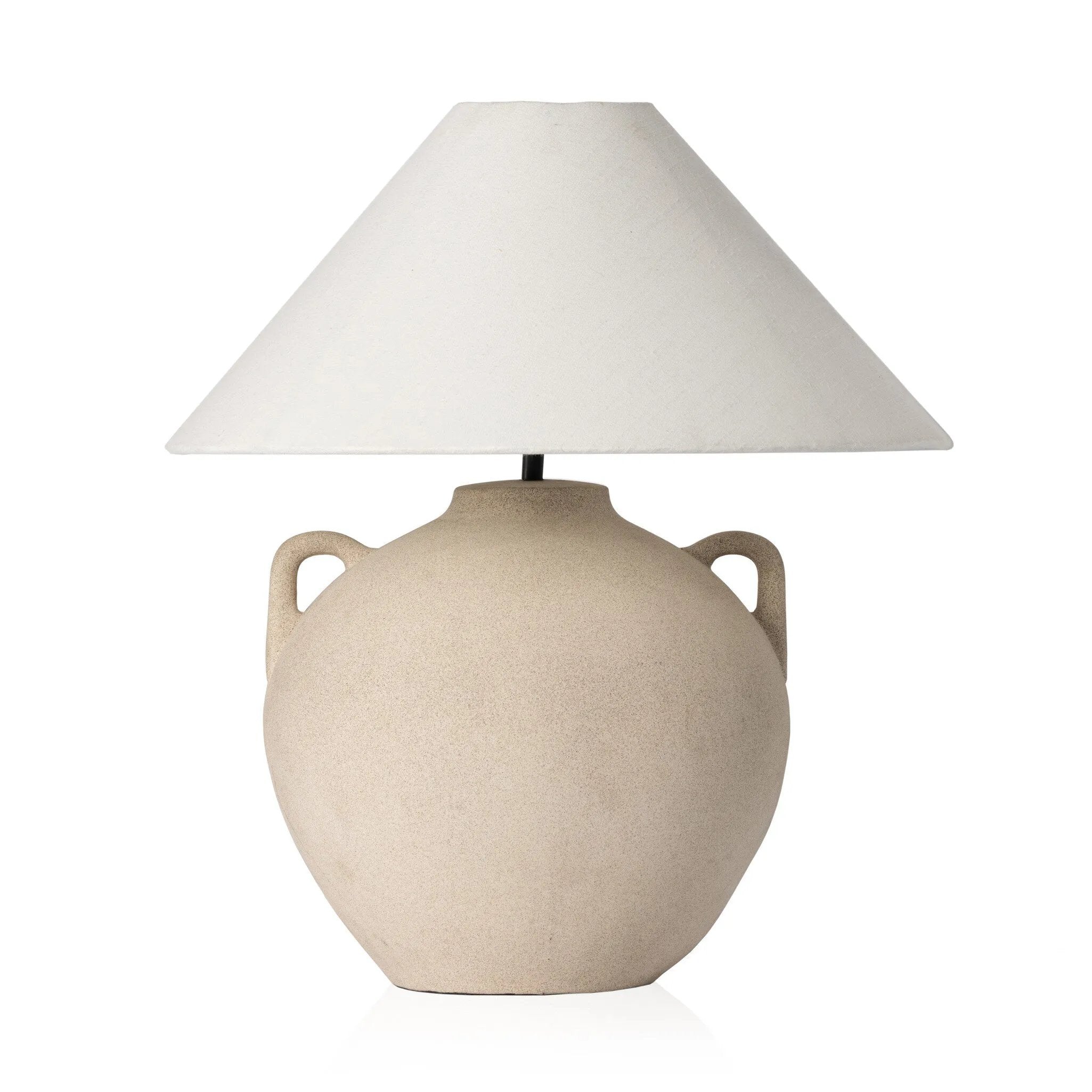Inspired by vintage clay jars, a light sand-colored talavera lamp with handle-like detailing pairs with a tapered linen shade in a versatile ivory Amethyst Home provides interior design, new home construction design consulting, vintage area rugs, and lighting in the Miami metro area.