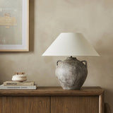 Featuring Mays Vintage Brown Ceramic Table Lamp by Four Hands at Amethyst Home. Inspired by vintage clay jars, a brown talavera lamp with handle-like detailing pairs with a tapered linen shade in a versatile ivory. Overall Dimensions: 22.00"w x 22.00"d x 21.00"h. Amethyst Home provides interior design, new home construction design consulting, vintage area rugs, and lighting in the Miami metro area.