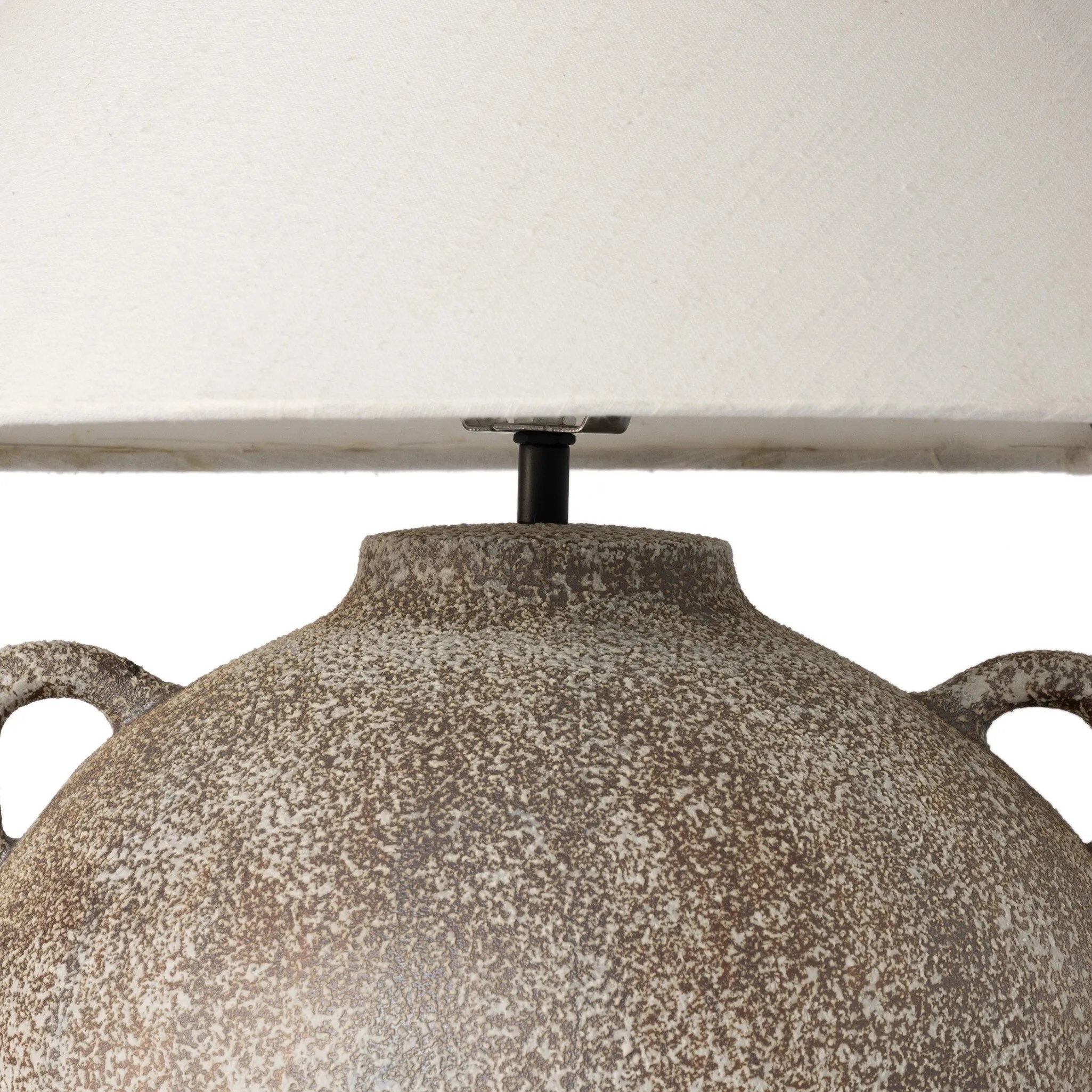 Featuring Mays Vintage Brown Ceramic Table Lamp by Four Hands at Amethyst Home. Inspired by vintage clay jars, a brown talavera lamp with handle-like detailing pairs with a tapered linen shade in a versatile ivory. Overall Dimensions: 22.00"w x 22.00"d x 21.00"h. Amethyst Home provides interior design, new home construction design consulting, vintage area rugs, and lighting in the Seattle metro area.