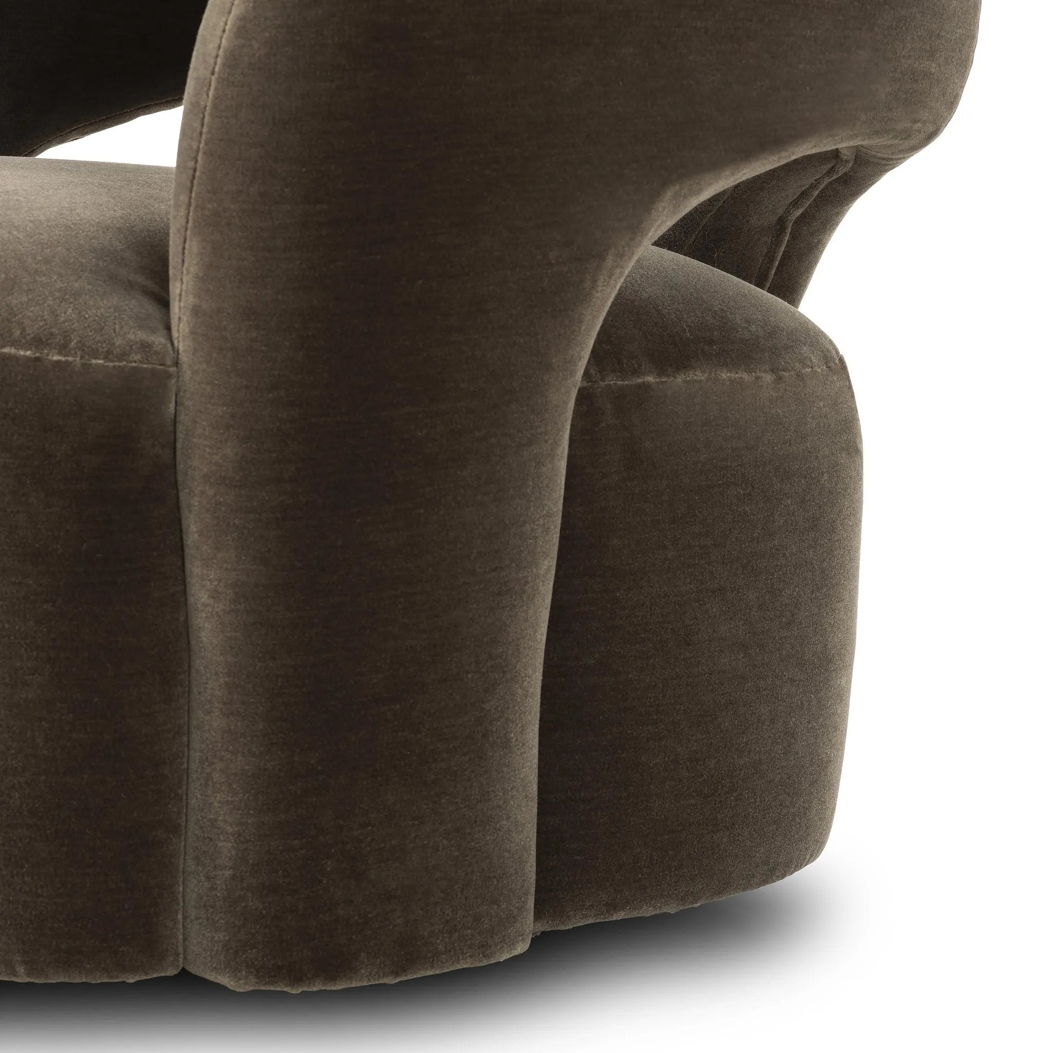 Featuring Mazie Monte Olive Swivel Chair by Four Hands at Amethyst Home. A fluid play on seating. This statement-making swivel chair features subtle cutouts on the back, with plush arms that hug the seat. Upholstered in an olive faux wool-mohair, bringing a plush moment to a classic frame.Overall Dimensions: 36.00"w x 32.00"d x 28.50"hWeight : 71.65 lbsMat. Amethyst Home provides interior design, new home construction design consulting, vintage area rugs, and lighting in the Washington metro area.