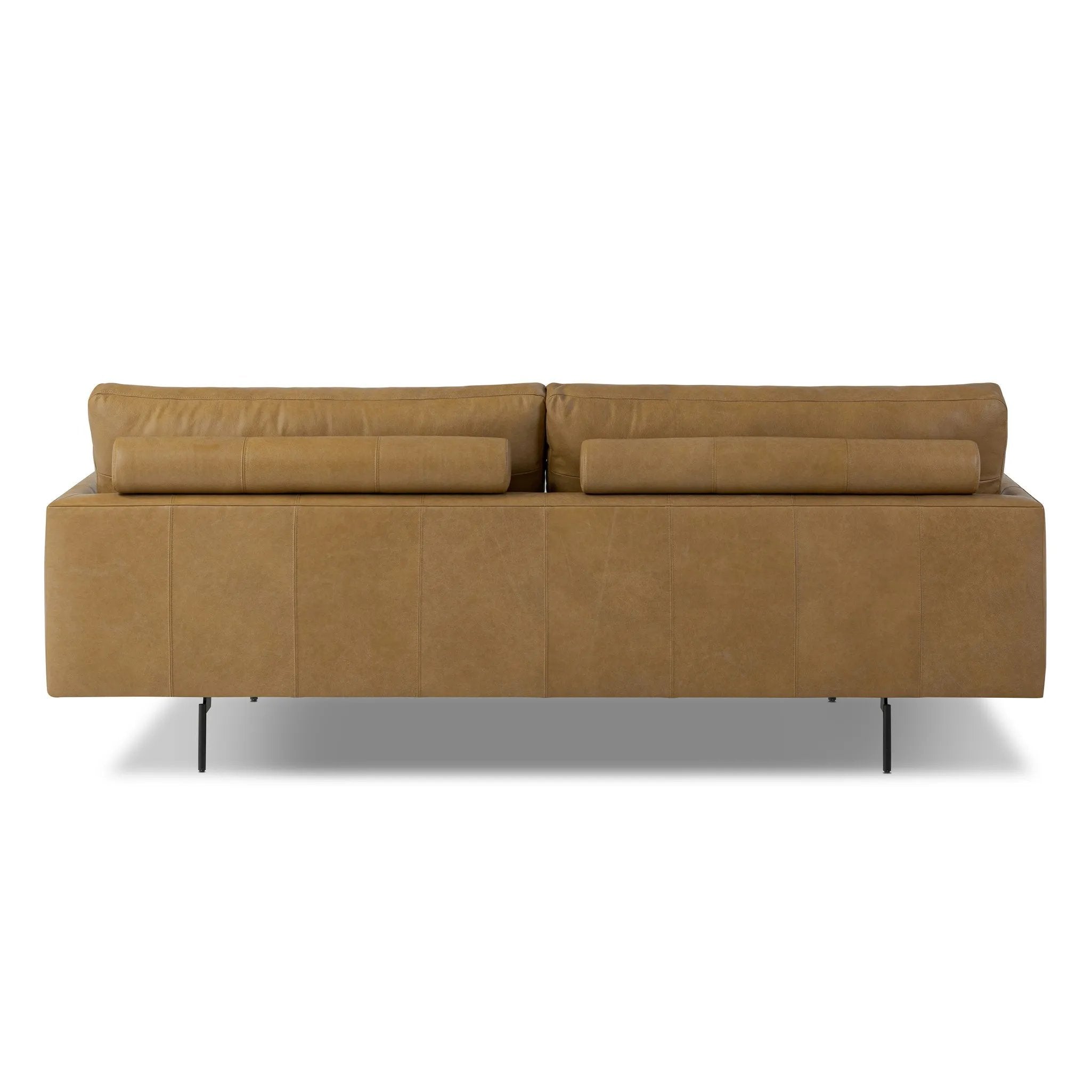 A minimalist form to redefine contemporary seating. Made from tan top-grain leather with a slim profile, expert tailoring and plush cushions for comfort. Sleek metal legs and compact sizing make this piece a versatile anchor for smaller living spaces Amethyst Home provides interior design, new home construction design consulting, vintage area rugs, and lighting in the Calabasas metro area.
