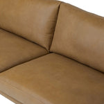 A minimalist form to redefine contemporary seating. Made from tan top-grain leather with a slim profile, expert tailoring and plush cushions for comfort. Sleek metal legs and compact sizing make this piece a versatile anchor for smaller living spaces Amethyst Home provides interior design, new home construction design consulting, vintage area rugs, and lighting in the Laguna Beach metro area.