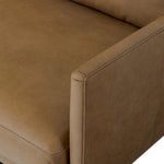 A minimalist form to redefine contemporary seating. Made from tan top-grain leather with a slim profile, expert tailoring and plush cushions for comfort. Sleek metal legs and compact sizing make this piece a versatile anchor for smaller living spaces Amethyst Home provides interior design, new home construction design consulting, vintage area rugs, and lighting in the Los Angeles metro area.
