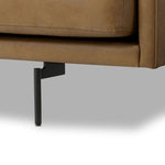 A minimalist form to redefine contemporary seating. Made from tan top-grain leather with a slim profile, expert tailoring and plush cushions for comfort. Sleek metal legs and compact sizing make this piece a versatile anchor for smaller living spaces Amethyst Home provides interior design, new home construction design consulting, vintage area rugs, and lighting in the Omaha metro area.