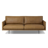 A minimalist form to redefine contemporary seating. Made from tan top-grain leather with a slim profile, expert tailoring and plush cushions for comfort. Sleek metal legs and compact sizing make this piece a versatile anchor for smaller living spaces Amethyst Home provides interior design, new home construction design consulting, vintage area rugs, and lighting in the Tampa metro area.