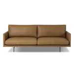 A minimalist form to redefine contemporary seating. Made from tan top-grain leather with a slim profile, expert tailoring and plush cushions for comfort. Sleek metal legs and compact sizing make this piece a versatile anchor for smaller living spaces Amethyst Home provides interior design, new home construction design consulting, vintage area rugs, and lighting in the Washington metro area.
