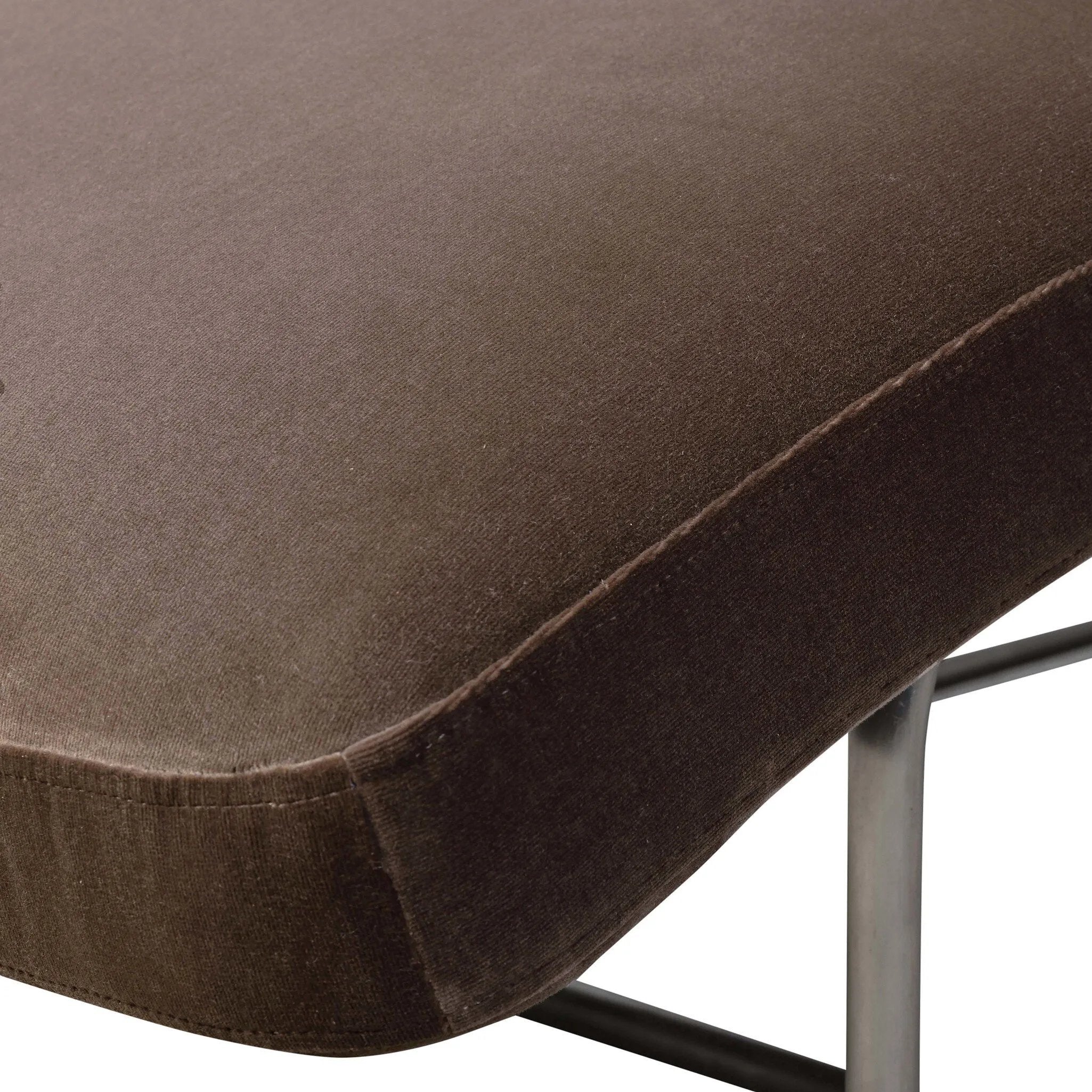 Contoured for comfort, this minimalist chaise is fixed with ideal ergonomics so you can simply sit back and unwind. Inspired by 1960s European design, the chaise blends a utilitarian aesthetic with high-quality tufting, stainless-steel framing, and smooth upholstery. The adjustable headrest is secured by a metal closure and magnetic strip. Amethyst Home provides interior design, new home construction design consulting, vintage area rugs, and lighting in the Los Angeles metro area.
