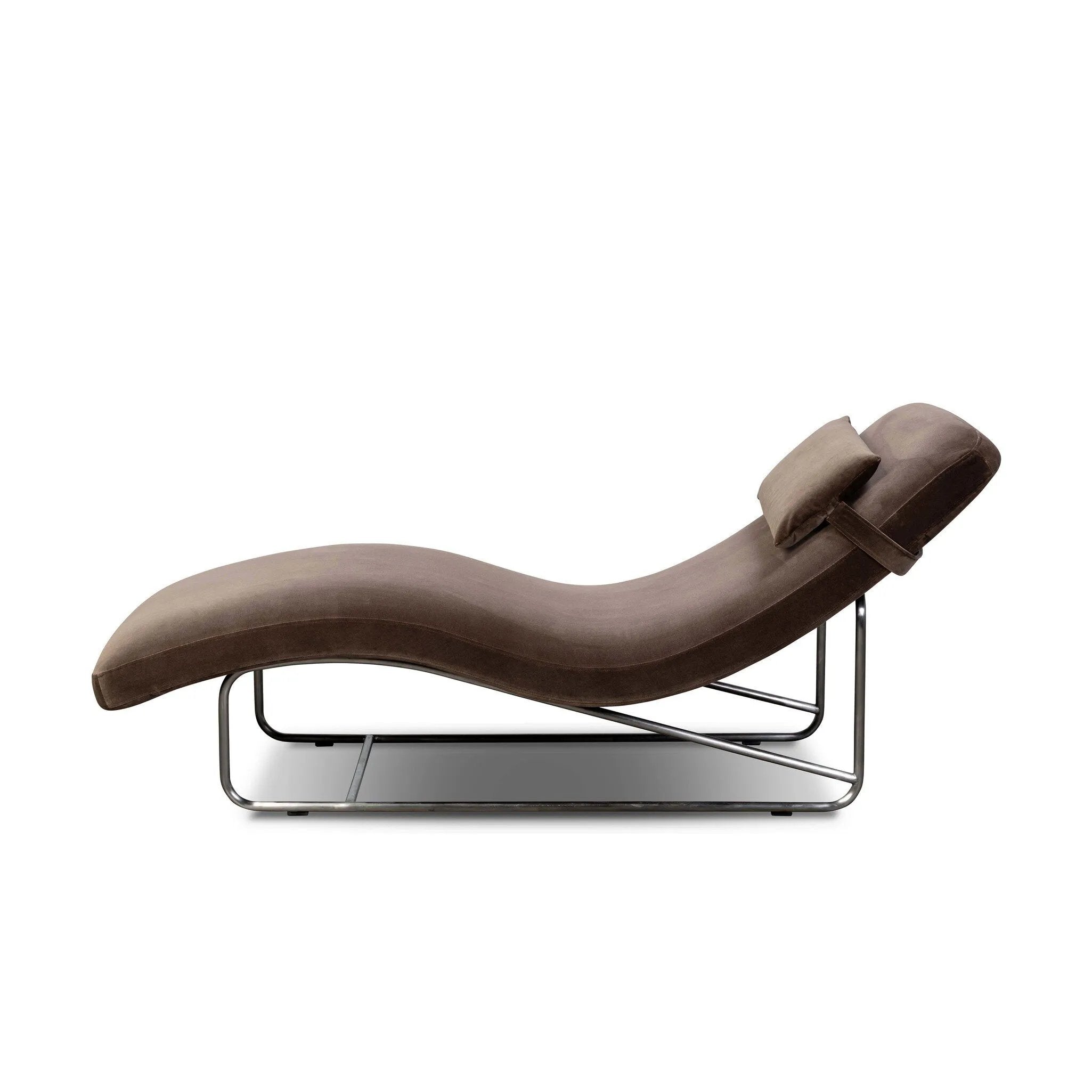Contoured for comfort, this minimalist chaise is fixed with ideal ergonomics so you can simply sit back and unwind. Inspired by 1960s European design, the chaise blends a utilitarian aesthetic with high-quality tufting, stainless-steel framing, and smooth upholstery. The adjustable headrest is secured by a metal closure and magnetic strip. Amethyst Home provides interior design, new home construction design consulting, vintage area rugs, and lighting in the San Diego metro area.