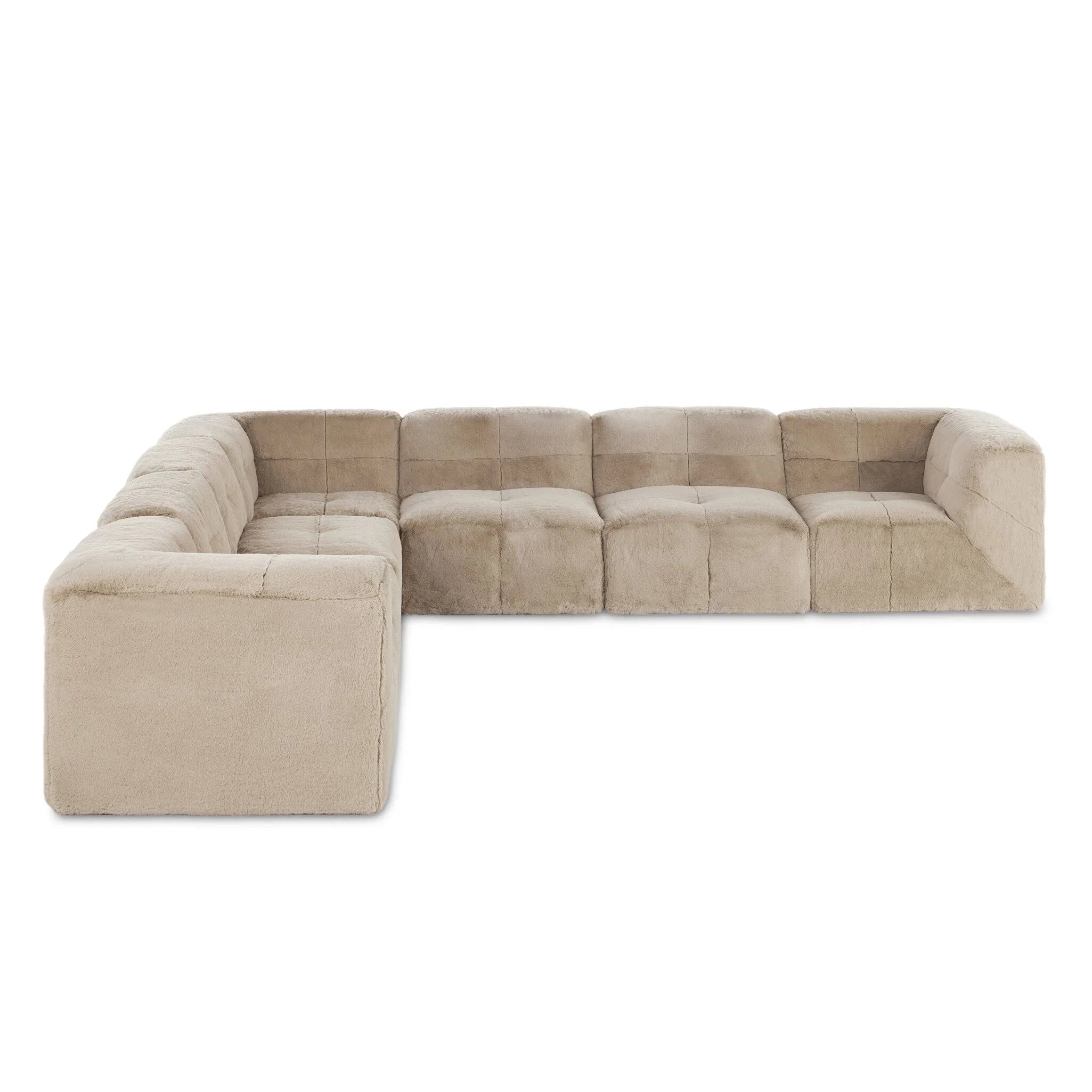 Modularity at its best, and softest. This versatile sectional includes seven pieces crafted with soft cushioning and S-spring suspension for a supportive sit. All covered in a plush, furry fabric that feels luxurious to sink into. Discreet seams add a touch of structure throughout Amethyst Home provides interior design, new home construction design consulting, vintage area rugs, and lighting in the Tampa metro area.