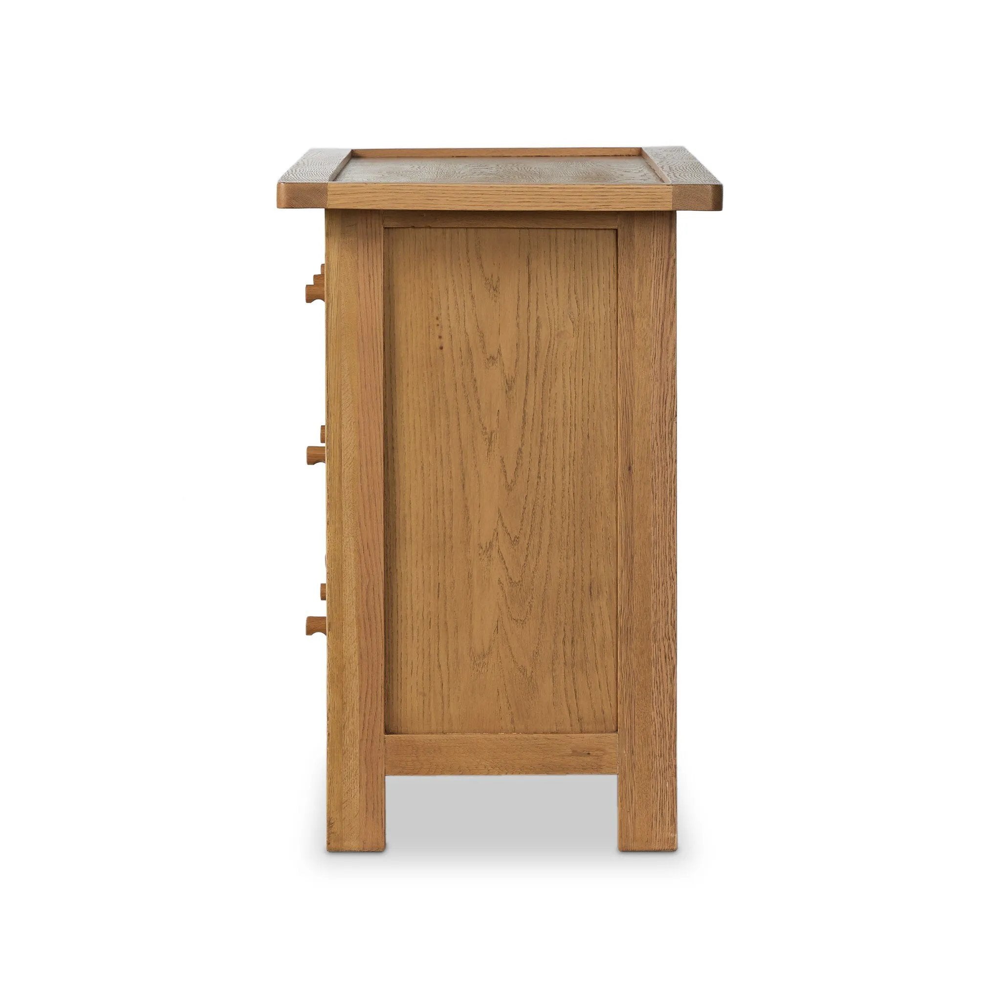 Drawing inspiration from a vintage general store counter, a storage-driven dresser reflects traditional and functional design. Thick oak legs with softened corners provide sturdy support, while oak knobs add a classic touch. An inset tray top and a versatile drawer configuration offer ample storage Amethyst Home provides interior design, new home construction design consulting, vintage area rugs, and lighting in the Houston metro area.