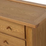Drawing inspiration from a vintage general store counter, a storage-driven dresser reflects traditional and functional design. Thick oak legs with softened corners provide sturdy support, while oak knobs add a classic touch. An inset tray top and a versatile drawer configuration offer ample storage Amethyst Home provides interior design, new home construction design consulting, vintage area rugs, and lighting in the Scottsdale metro area.
