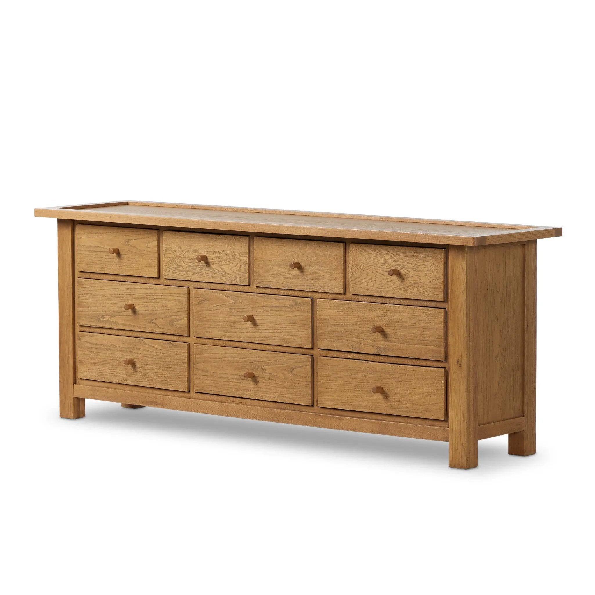 Drawing inspiration from a vintage general store counter, a storage-driven dresser reflects traditional and functional design. Thick oak legs with softened corners provide sturdy support, while oak knobs add a classic touch. An inset tray top and a versatile drawer configuration offer ample storage Amethyst Home provides interior design, new home construction design consulting, vintage area rugs, and lighting in the Washington metro area.