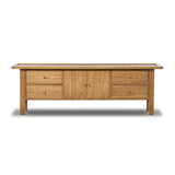 Featuring Millbrook Natural Light Oak Media Console by Four Hands at Amethyst Home. Inspired by a vintage general store counter, this console table features a heritage design with a modern twist. Thick oak legs with softened corners provide sturdy support, while oak knobs add a touch of classic charm. The inset tray top and varied drawer configuration offer am. Amethyst Home provides interior design, new home construction design consulting, vintage area rugs, and lighting in the Dallas metro area.