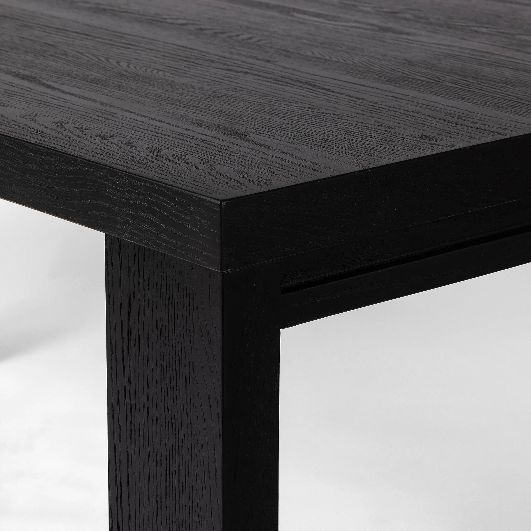 Featuring Millie Drifted Matte Black Veneer Dining Table by Four Hands at Amethyst Home. Angled legs place a modern twist on the timeless Parsons table. Versatile black-finished oak moves between styles and color palettes with ease.
Overall Dimensions: 35.0" L x 72.0 " W x 30.0" H
Materials: Oak Veneer, Solid Oak, Poplar PlywoodWeight: 154.32 lbs. Amethyst Home provides interior design, new home construction design consulting, vintage area rugs, and lighting in the Newport Beach metro area.