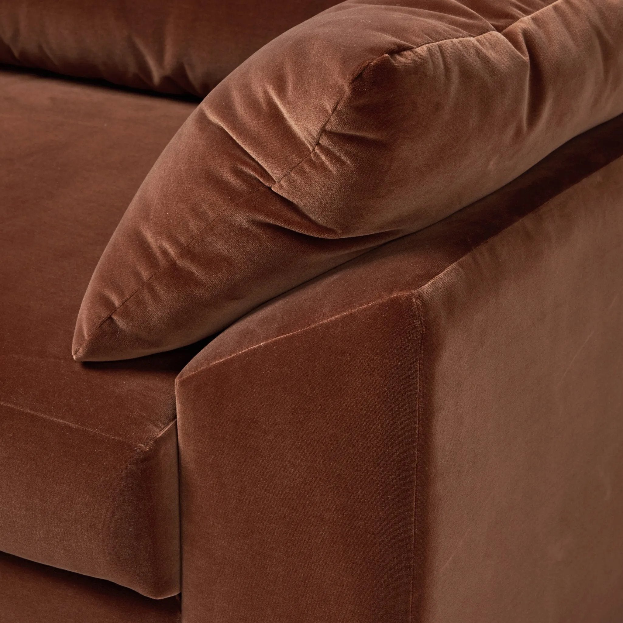 Structured yet deceivingly comfortable. The pillow-engulfed sofa features a distinctive raised seat deck with knife-edge cushions. Tapered arms include integrated pillows, while the tight seat-back provides a stable resting spot for its plush, loose-back pillows. Amethyst Home provides interior design, new home construction design consulting, vintage area rugs, and lighting in the Park City metro area.