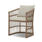 Cottage-inspired, faux hyacinth mimics its natural counterpart, with joint wrapping and texture for depth and character defining this outdoor dining chair. Varied proportion for dimension. Upholstered in a UV-resistant, water-repellent, quick-drying fabric. Cover or store indoors during inclement weather and when not in use Amethyst Home provides interior design, new home construction design consulting, vintage area rugs, and lighting in the Calabasas metro area.