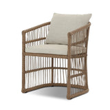 Cottage-inspired, faux hyacinth mimics its natural counterpart, with joint wrapping and texture for depth and character defining this outdoor dining chair. Varied proportion for dimension. Upholstered in a UV-resistant, water-repellent, quick-drying fabric. Cover or store indoors during inclement weather and when not in use Amethyst Home provides interior design, new home construction design consulting, vintage area rugs, and lighting in the Calabasas metro area.