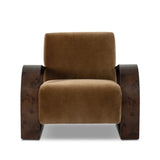 A luxe material mix at play. Deep plush seating in a high pile velvet is paired with an exaggerated 1920s Art Deco-inspired frame. Its bentwood arms are sculpted from mappa burl for extra movement throughout the piece. Amethyst Home provides interior design, new home construction design consulting, vintage area rugs, and lighting in the Houston metro area.