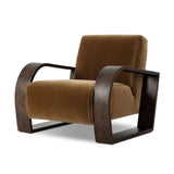 A luxe material mix at play. Deep plush seating in a high pile velvet is paired with an exaggerated 1920s Art Deco-inspired frame. Its bentwood arms are sculpted from mappa burl for extra movement throughout the piece. Amethyst Home provides interior design, new home construction design consulting, vintage area rugs, and lighting in the Omaha metro area.